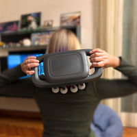 Massager being used on back muscles